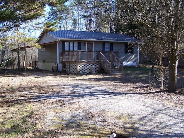 ranch-style house with a wooden deck