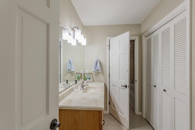 bathroom with vanity and tile patterned floors