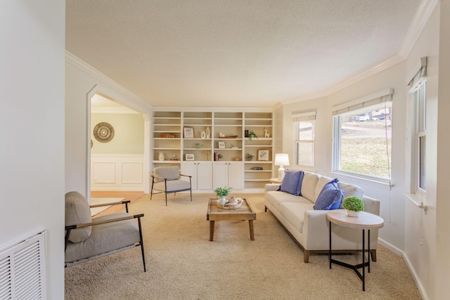 interior space with ornamental molding and a textured ceiling