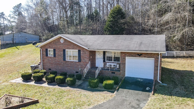 single story home featuring a garage and a front yard