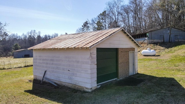 garage featuring a yard