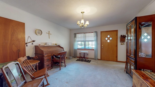 carpeted entrance foyer featuring an inviting chandelier and a textured ceiling