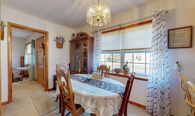 dining room featuring light colored carpet and a notable chandelier