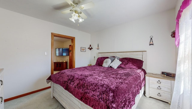 carpeted bedroom featuring ceiling fan and connected bathroom