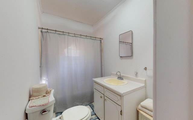 bathroom featuring vanity, crown molding, toilet, and a shower with shower curtain