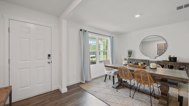 dining area with dark hardwood / wood-style floors