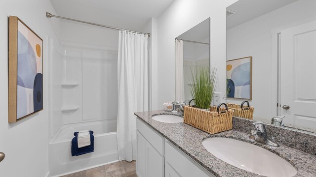 bathroom with vanity and shower / bath combination with curtain