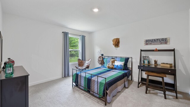 bedroom featuring light colored carpet