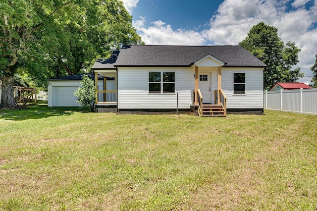 view of front of property featuring a garage and a front yard