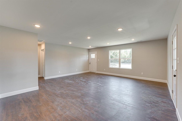 spare room featuring dark wood-type flooring