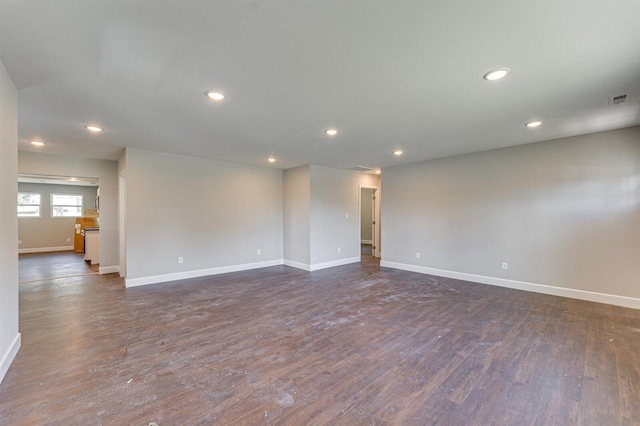 empty room with dark hardwood / wood-style floors