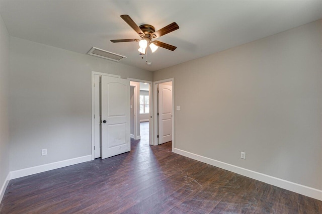 unfurnished room featuring ceiling fan and dark hardwood / wood-style flooring