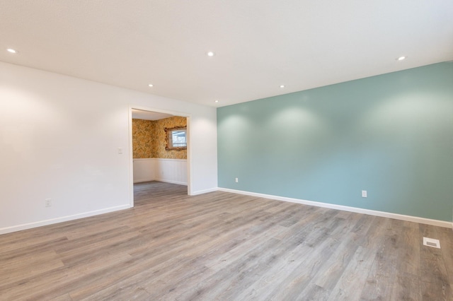 spare room with light hardwood / wood-style floors