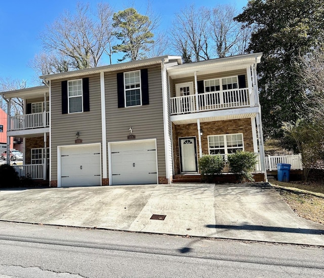 view of front of house featuring a balcony and a garage