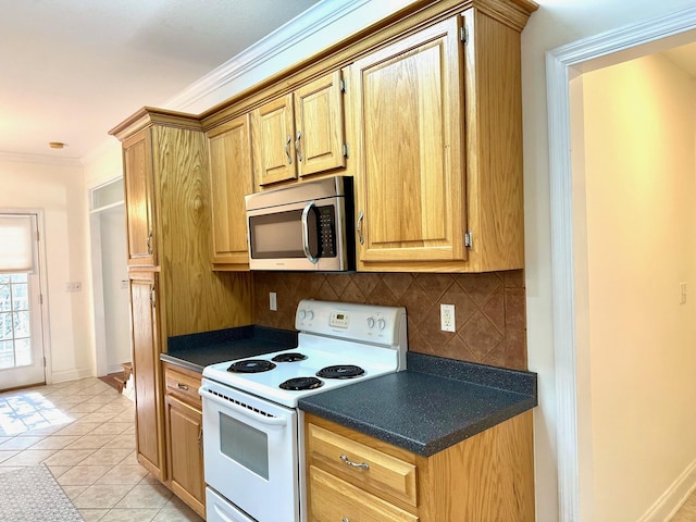 kitchen featuring crown molding, light tile patterned floors, decorative backsplash, and white range with electric stovetop