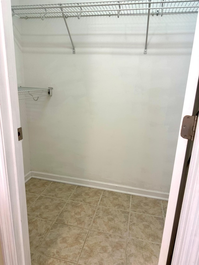 walk in closet featuring tile patterned floors