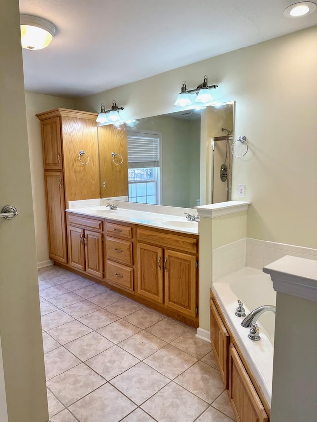 bathroom featuring vanity, tile patterned flooring, and independent shower and bath