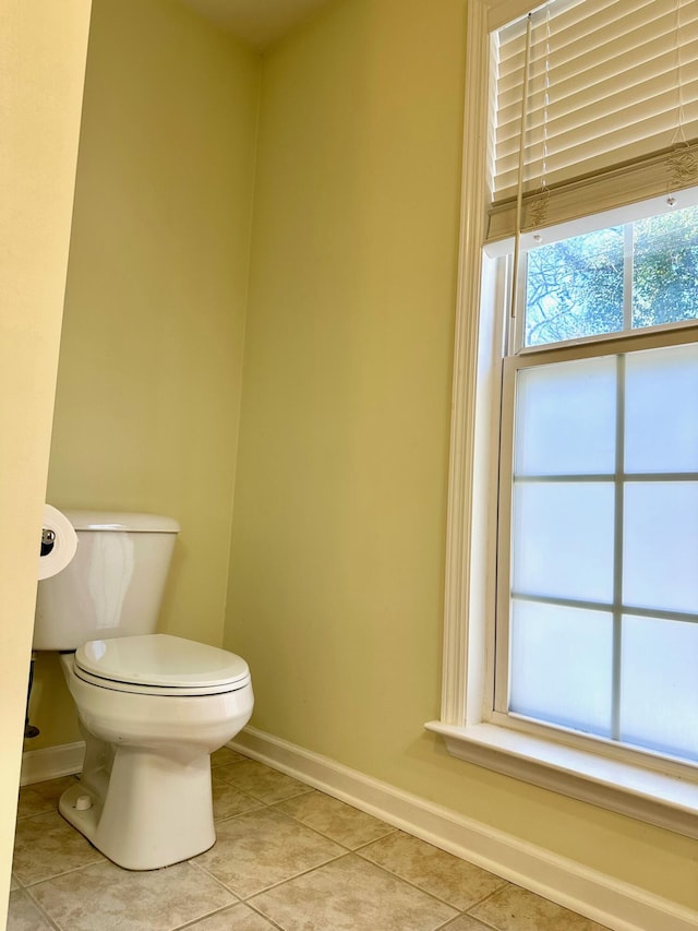 bathroom with tile patterned flooring and toilet