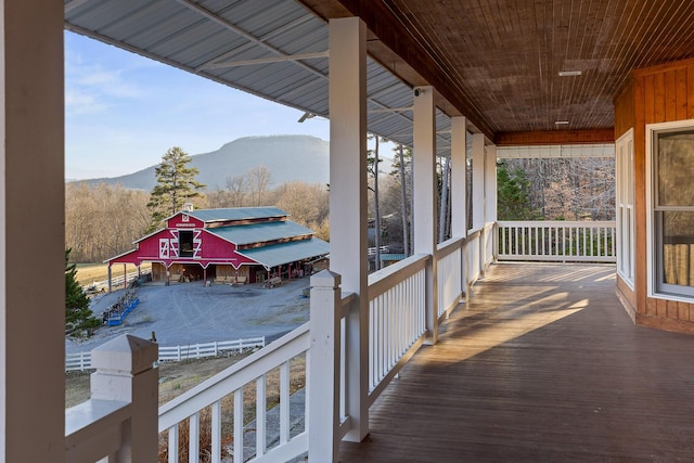 deck featuring an outdoor structure and a mountain view