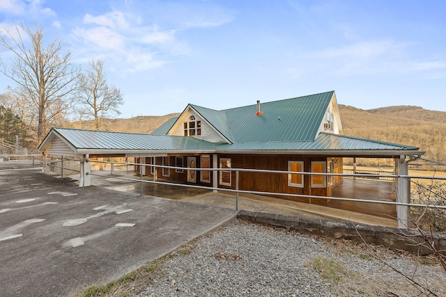 exterior space with a mountain view and an outbuilding