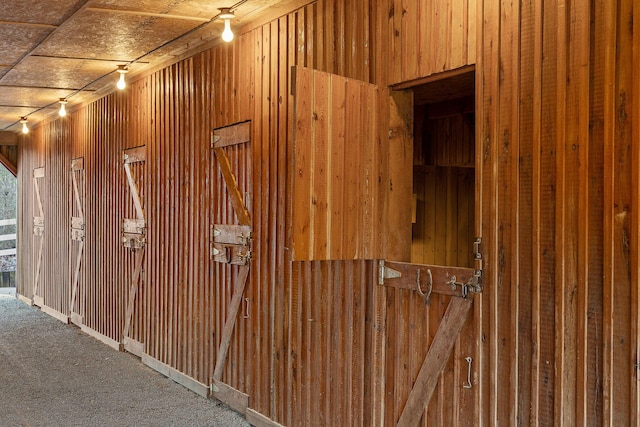 view of gate with an outbuilding