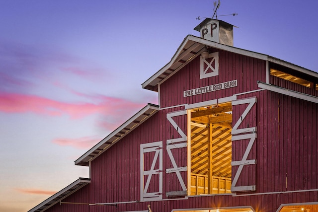 view of outdoor structure at dusk