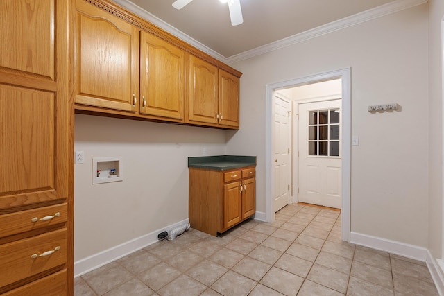 washroom featuring cabinets, ornamental molding, washer hookup, light tile patterned floors, and ceiling fan