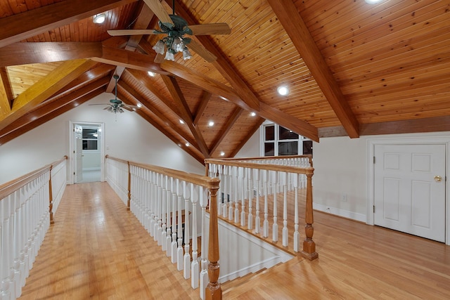 corridor with wood ceiling, light hardwood / wood-style flooring, and vaulted ceiling with beams