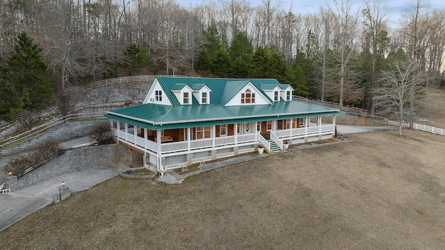 view of front of house featuring a front yard and covered porch