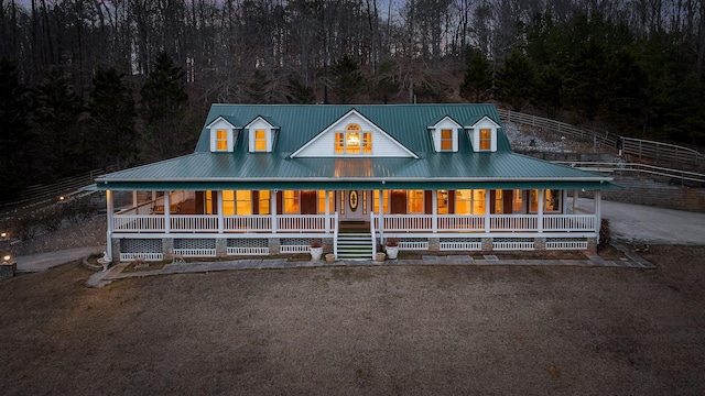 farmhouse inspired home featuring covered porch