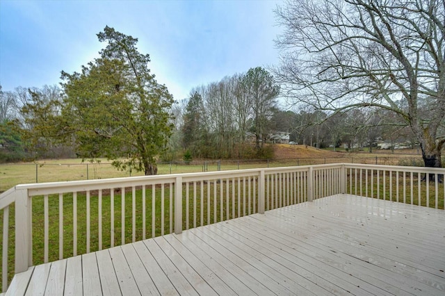 wooden deck featuring a yard