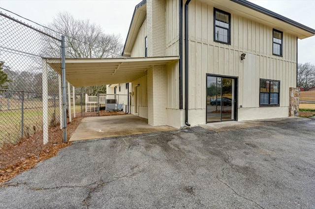 exterior space featuring a carport