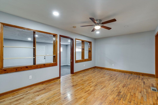 empty room featuring ceiling fan and light wood-type flooring