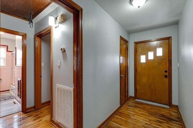 foyer with light hardwood / wood-style floors