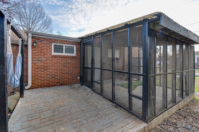 exterior space featuring a sunroom