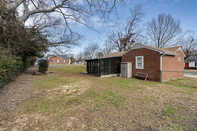 view of yard with a sunroom