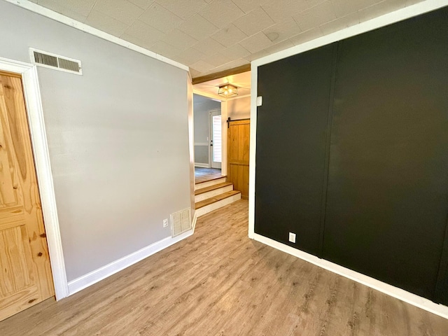 spare room with light wood-type flooring