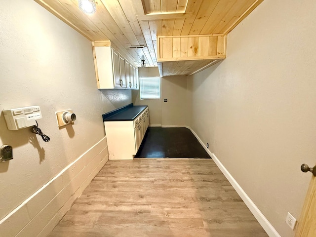 washroom featuring wood ceiling and light hardwood / wood-style flooring