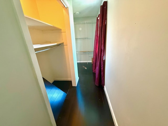 corridor featuring dark hardwood / wood-style floors