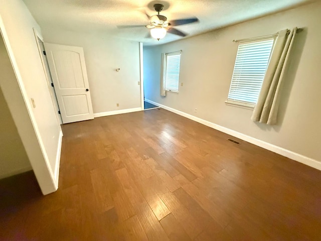 unfurnished bedroom featuring hardwood / wood-style flooring and ceiling fan