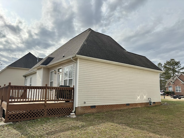 view of property exterior featuring a lawn and a deck