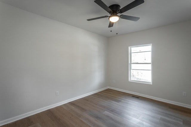 unfurnished room featuring hardwood / wood-style flooring and ceiling fan