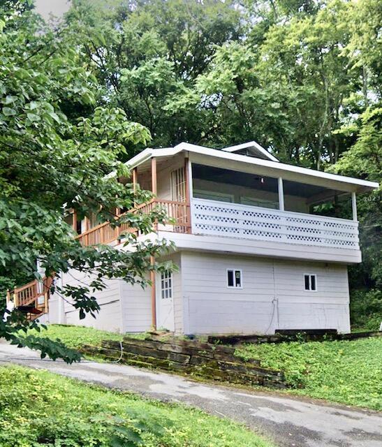 view of side of property with a balcony