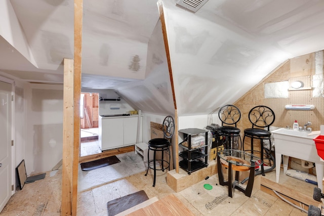 bonus room with lofted ceiling and visible vents