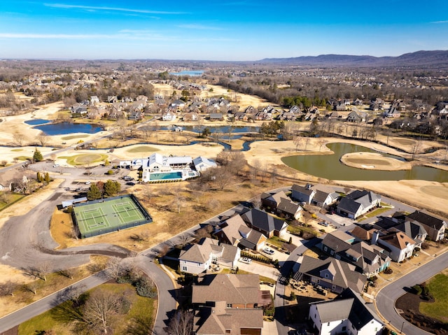 birds eye view of property featuring a residential view, a water and mountain view, and view of golf course
