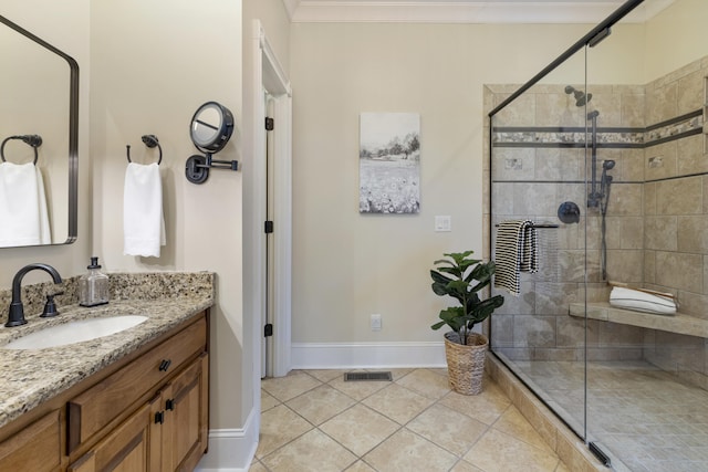 full bath featuring vanity, visible vents, ornamental molding, tile patterned flooring, and a shower stall
