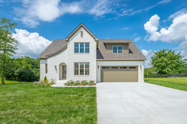 view of front facade featuring a garage and a front yard