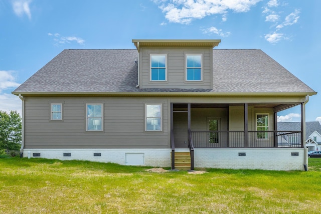 back of property with a porch and a lawn