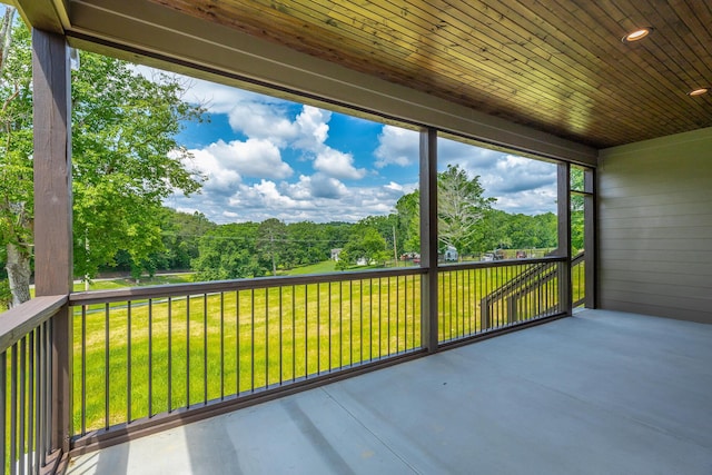 unfurnished sunroom featuring wooden ceiling