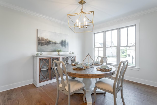 dining room featuring crown molding, a chandelier, and dark hardwood / wood-style flooring